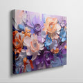 Framed canvas print of vibrant impasto-style abstract flowers in orange, lavender, and blue