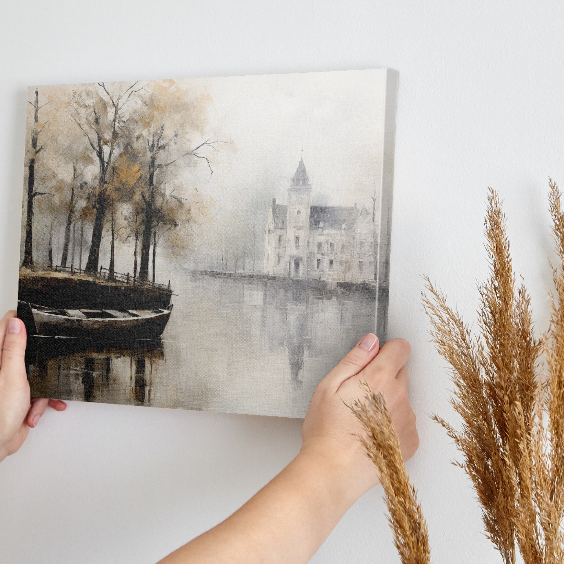 Framed canvas print of a historic chateau reflected on a lake with autumn trees and a rowboat in a misty scene