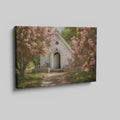 Framed canvas print of a chapel surrounded by lush pink blossom trees