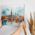 Framed canvas print of impressionist watercolor cityscape with autumn colors and urban reflection