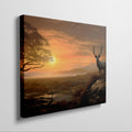 Framed canvas print of a majestic stag in a savanna sunset landscape with warm orange hues