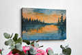 Framed canvas print of a watercolor sunset landscape with reflections over a calm lake