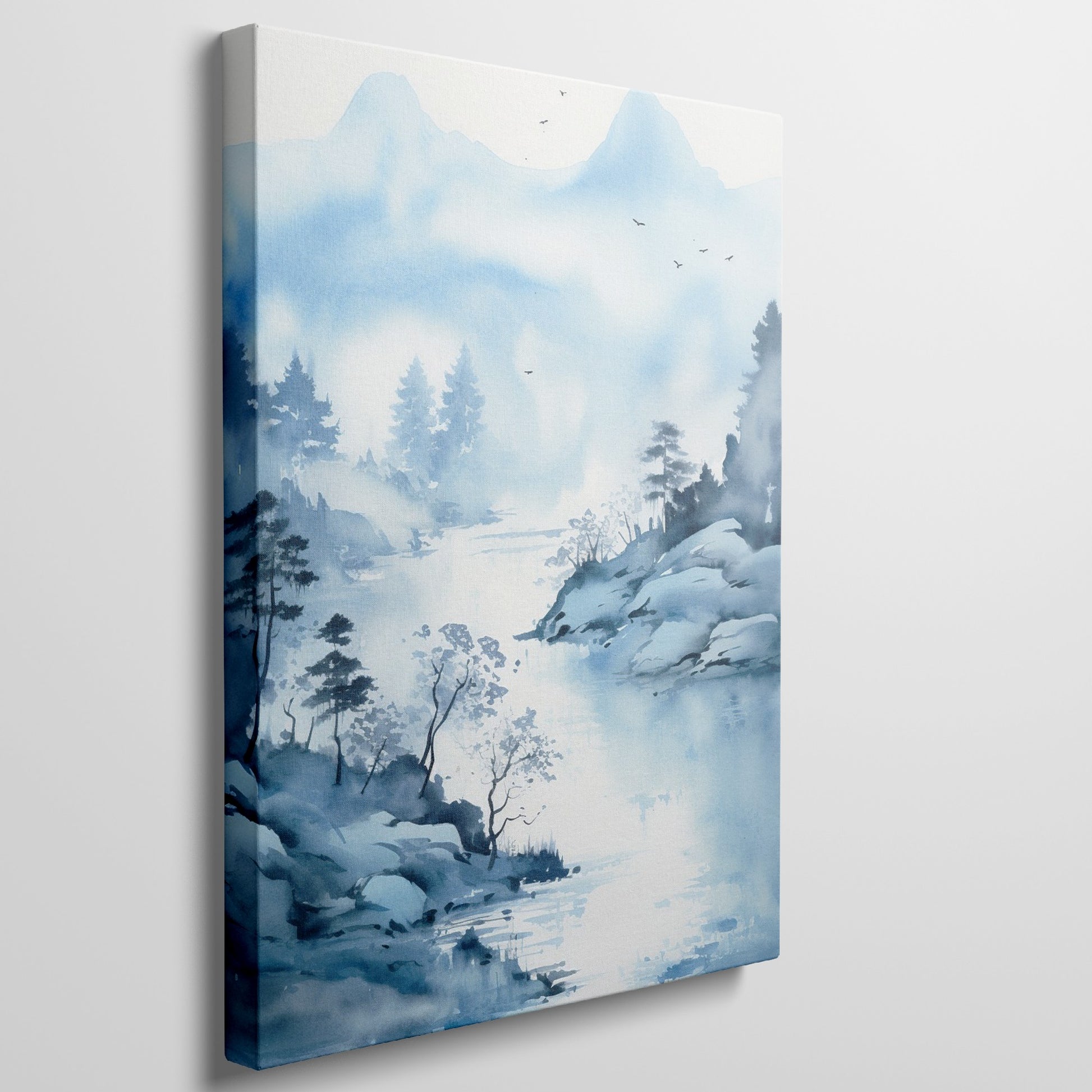 Framed canvas print of a tranquil blue watercolour landscape with misty mountains, silhouetted trees, and flying birds