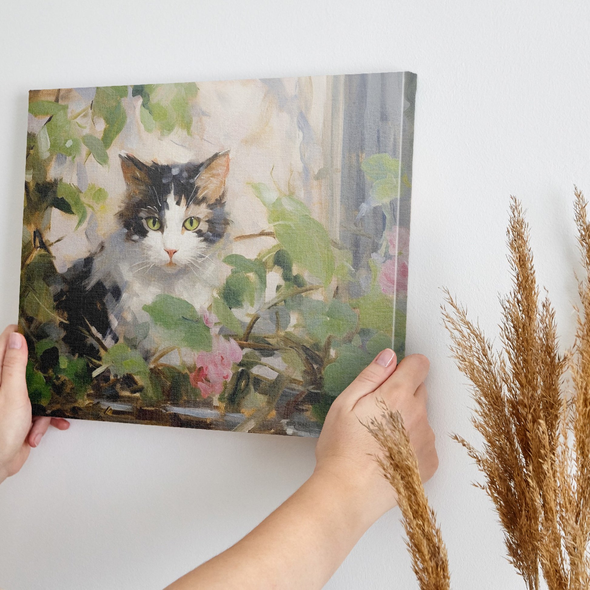 Framed canvas print of impressionist painting featuring a cat with roses and green leaves