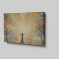 Framed canvas print of a figure silhouetted against a radiant background with mystical trees and glowing orbs.