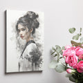 Framed canvas print of an abstract woman portrait in monochrome with dynamic ink splashes