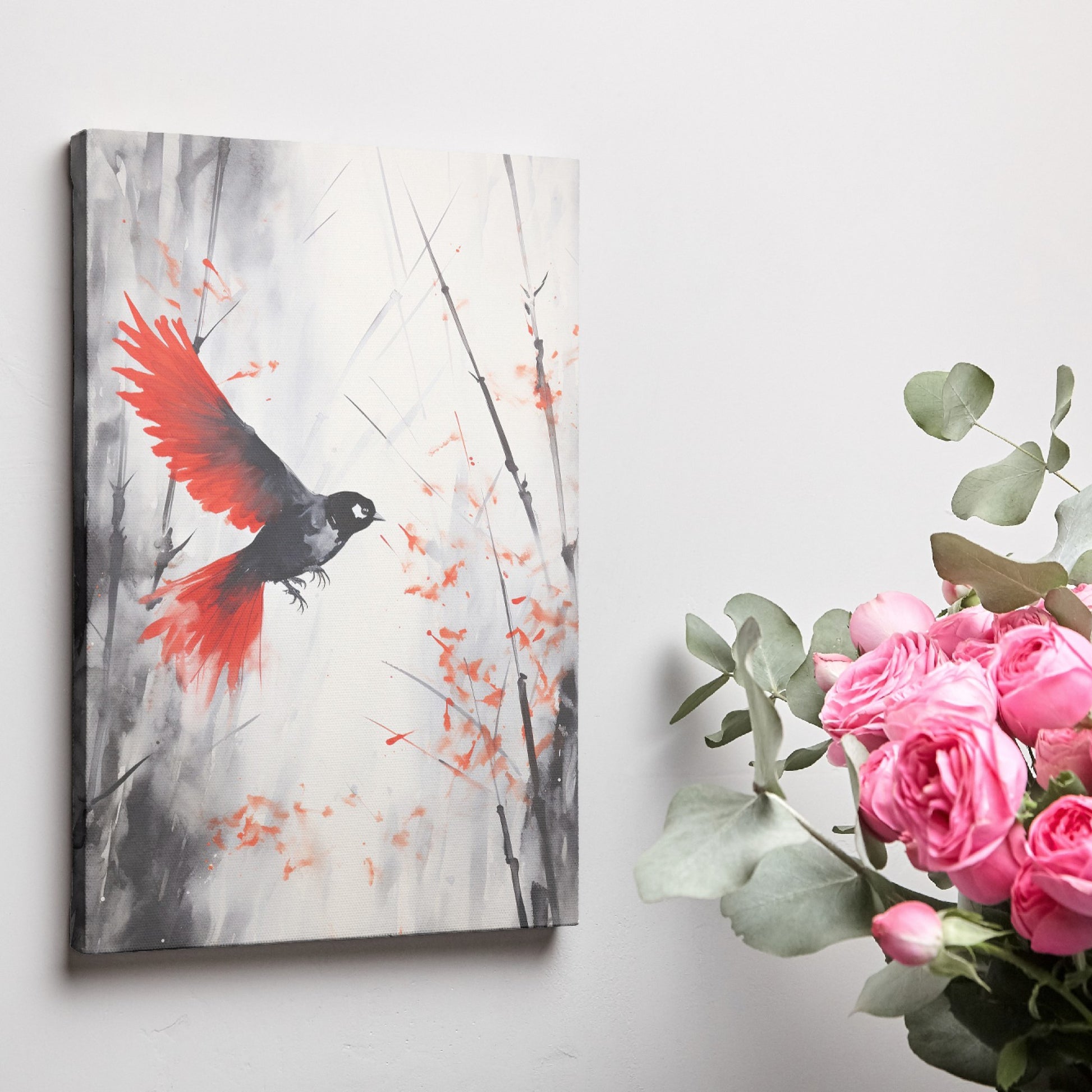 Framed canvas print of a stylised bird with vibrant red wings against a monochrome watercolor background