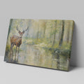 Framed canvas print of a deer standing beside a forest stream in impressionist style