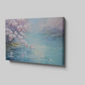 Framed canvas print of a serene landscape with cherry blossoms over tranquil waters