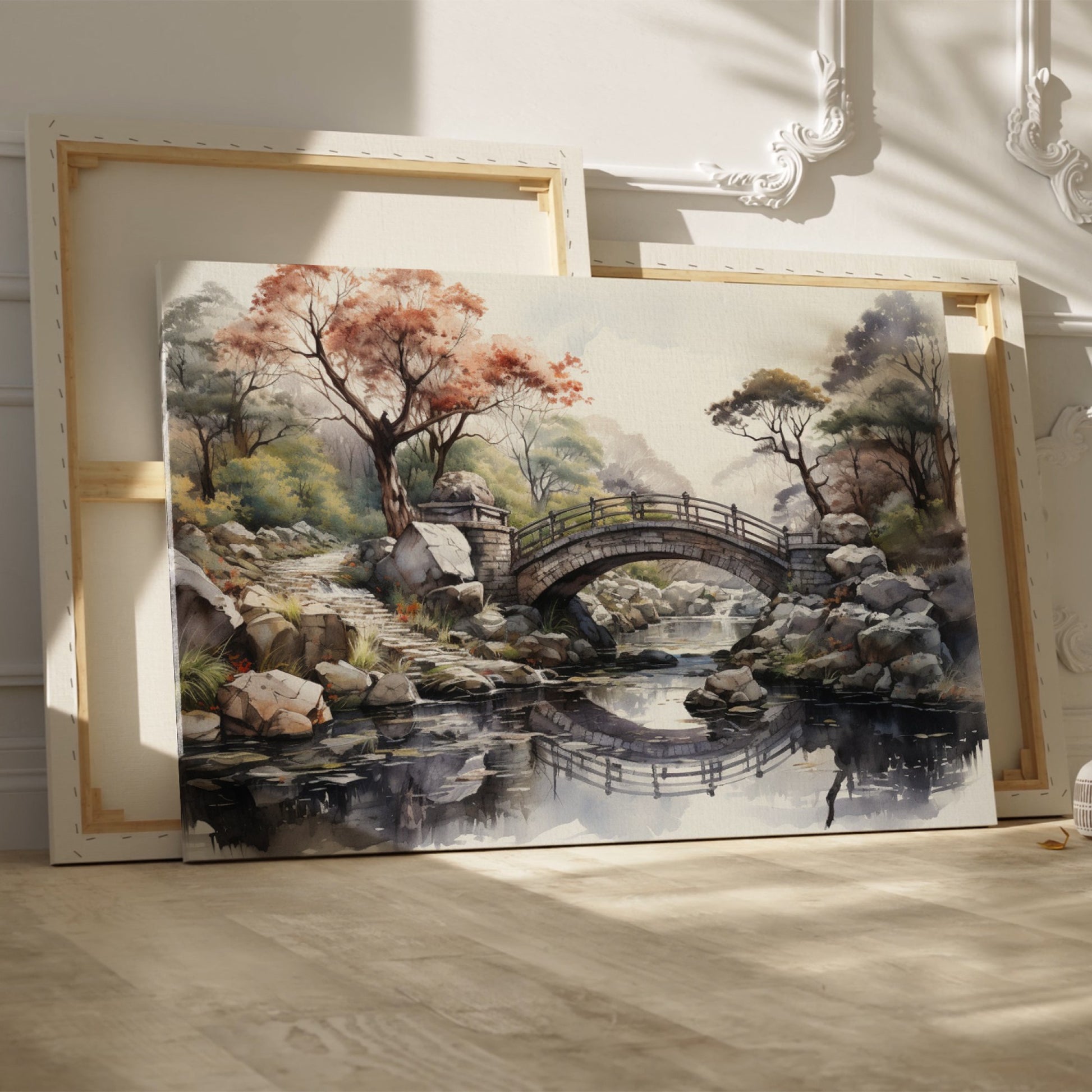 Framed canvas print of an autumnal stone bridge over a serene stream, surrounded by trees with watercolour details