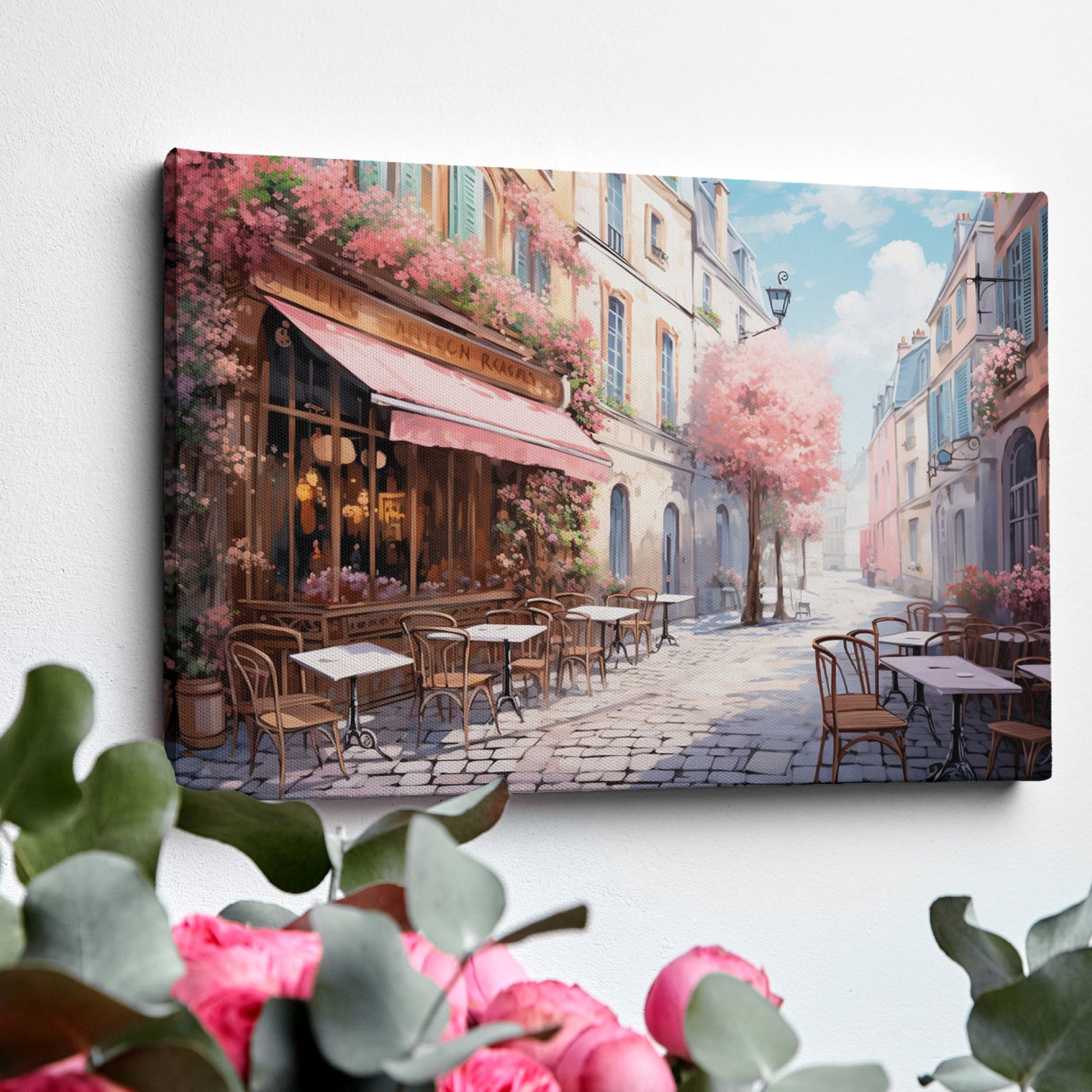 Framed canvas print of a picturesque Parisian alley with cherry blossoms and a street cafe scene in springtime