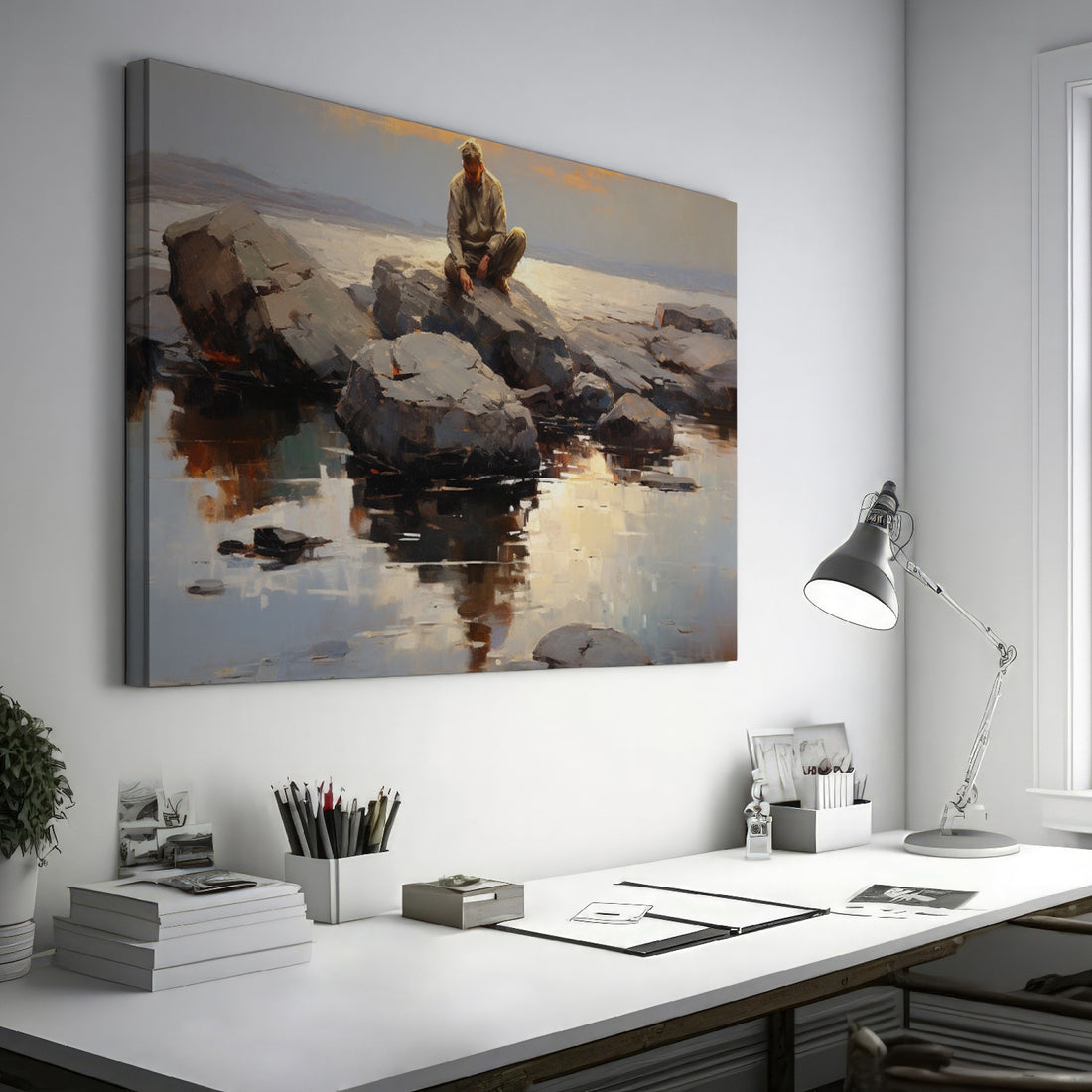 Framed canvas print of serene seascape with man sitting on rocks at sunset