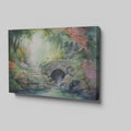 Framed canvas print of a tranquil watercolour garden with a stone bridge and flowing stream surrounded by colourful foliage