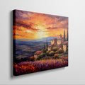 Framed canvas print of an Impressionist Tuscan landscape with a vibrant sunset sky, overlooking lavender fields and rustic houses.