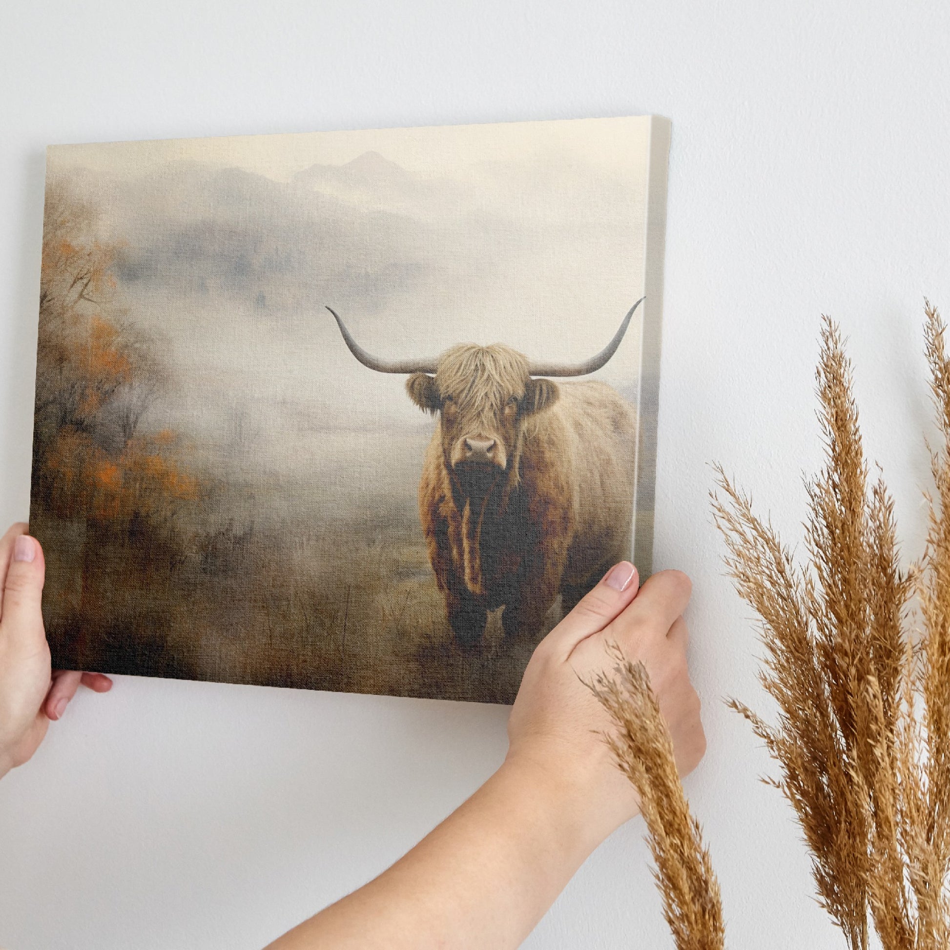 Framed canvas print of a Highland cow in a misty autumnal landscape with warm earthy tones