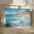 Framed canvas print of a Mediterranean village by the sea with vibrant blue waves and sunny sky