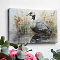 Framed canvas print of a crane amongst reeds in a watercolor wetland scene with neutral tones