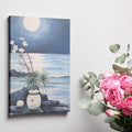 Blue and white moonlit seascape painting with flowers, rocks, and water