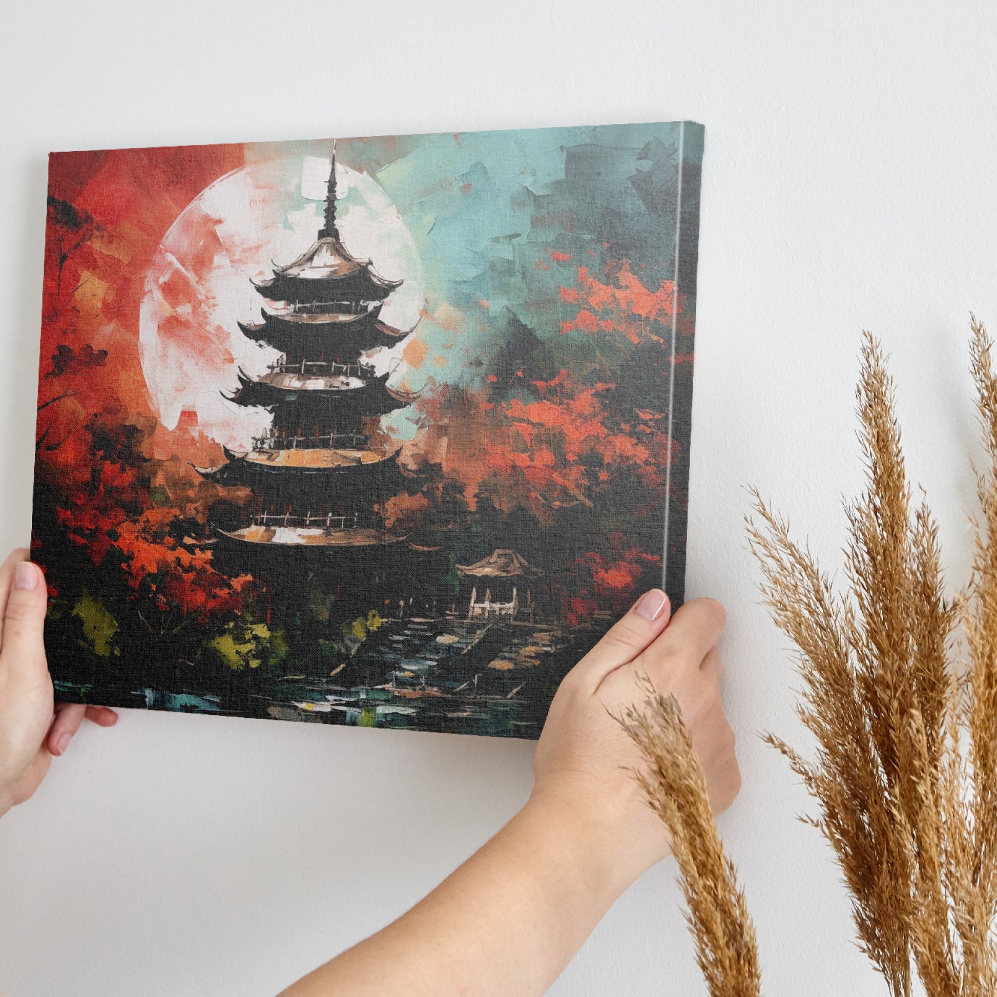 Framed canvas print of an oriental pagoda in crimson and teal colours with moonlit scenery