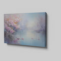 Framed canvas print of impressionist lakeside scene with blooming cherry blossoms and tranquil water reflections in pastel colours.