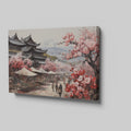 Framed canvas print of a traditional Japanese town during cherry blossom season with pink florals and historic architecture