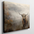 Framed canvas print of a Highland cow in a misty autumnal landscape with warm earthy tones