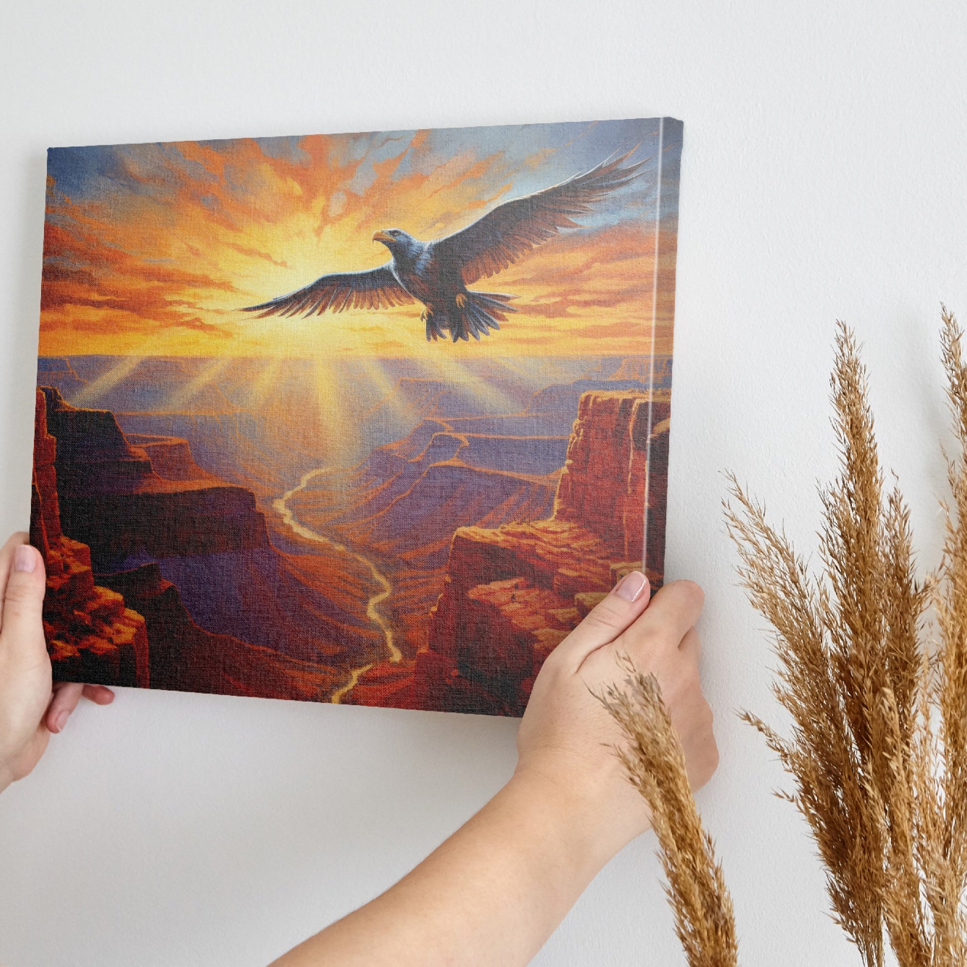 Framed canvas print of a majestic eagle soaring over a stunning canyon at sunset with radiant orange and red hues