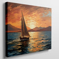 Framed canvas print of a sailboat against a vivid sunset with warm orange and blue tones