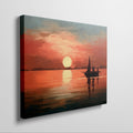 Framed canvas print of a sailboat silhouetted against a sunset with warm red and orange tones