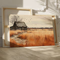 Framed canvas print of a rustic barn in autumn with golden fields and a stone pathway