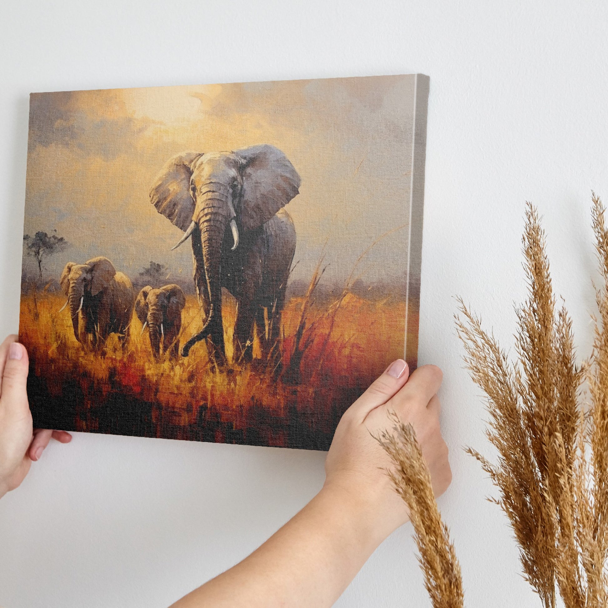 Framed canvas print of a family of elephants in a vibrant, golden savannah sunset