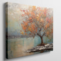 Framed canvas print of a textured autumnal tree with orange and gold foliage by a serene lake