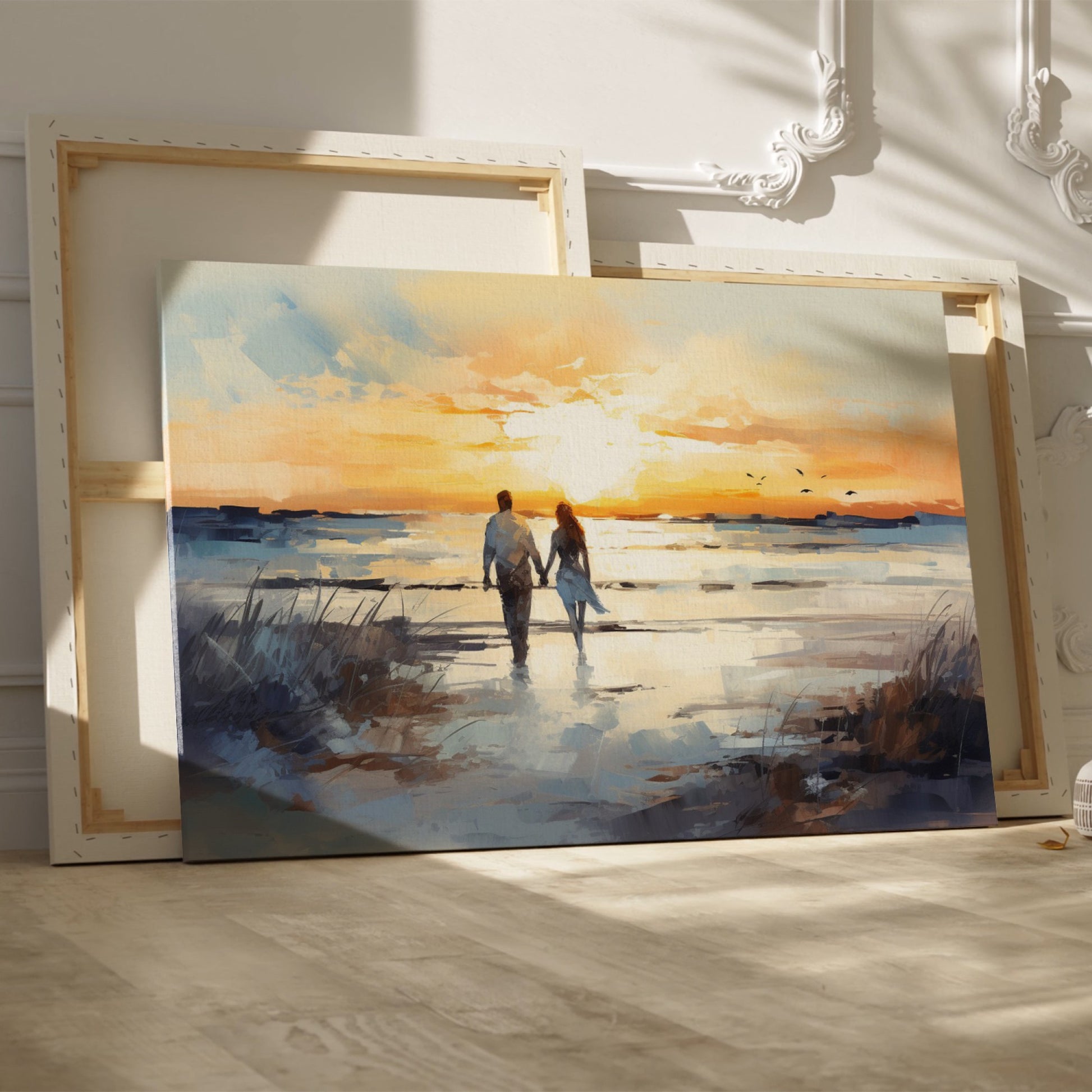 Framed canvas print of a couple walking on the beach at sunset with reflective water and warm colours