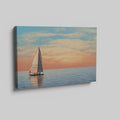 Sailboat on calming ocean waters during a vibrant sunset with orange and pink clouds in the sky.