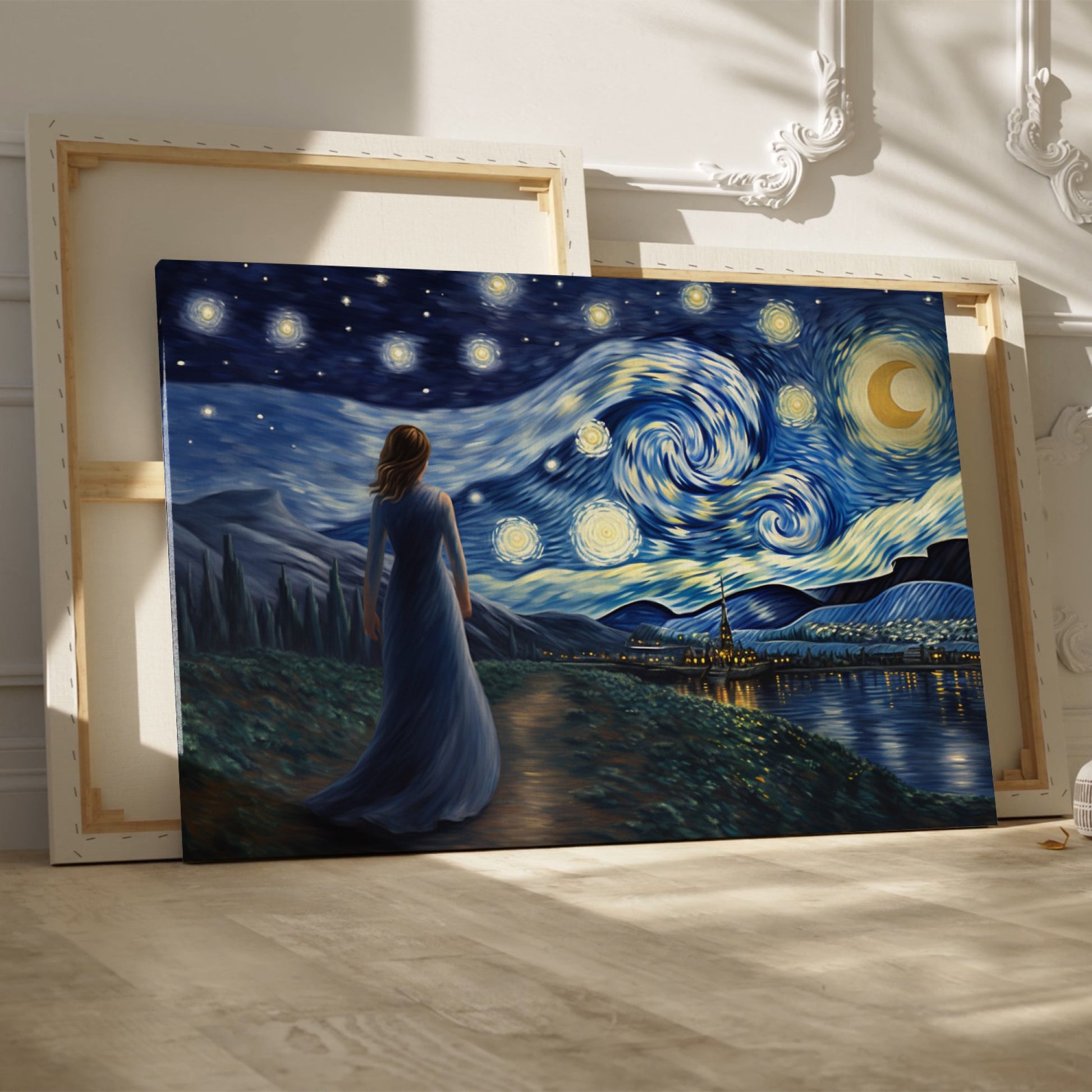 Framed canvas print of a woman in a blue dress gazing at a starry night sky with swirling patterns over a village