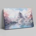 Framed canvas print of a Japanese pagoda surrounded by cherry blossoms and reflected in a tranquil pond