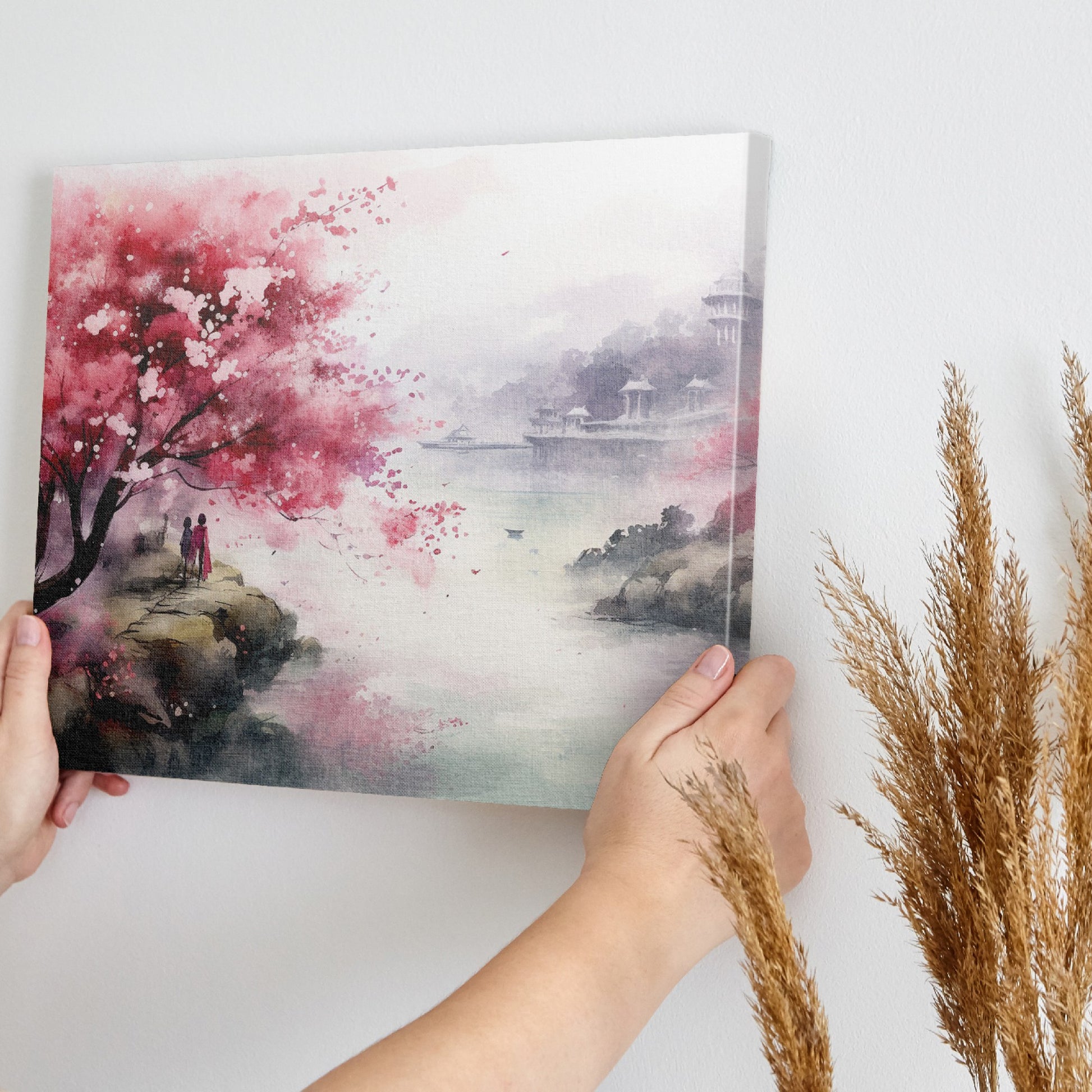 Framed canvas print of a watercolour cherry blossom landscape with figures and traditional architecture