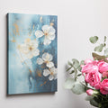 Framed canvas print of blue and gold abstract floral artwork