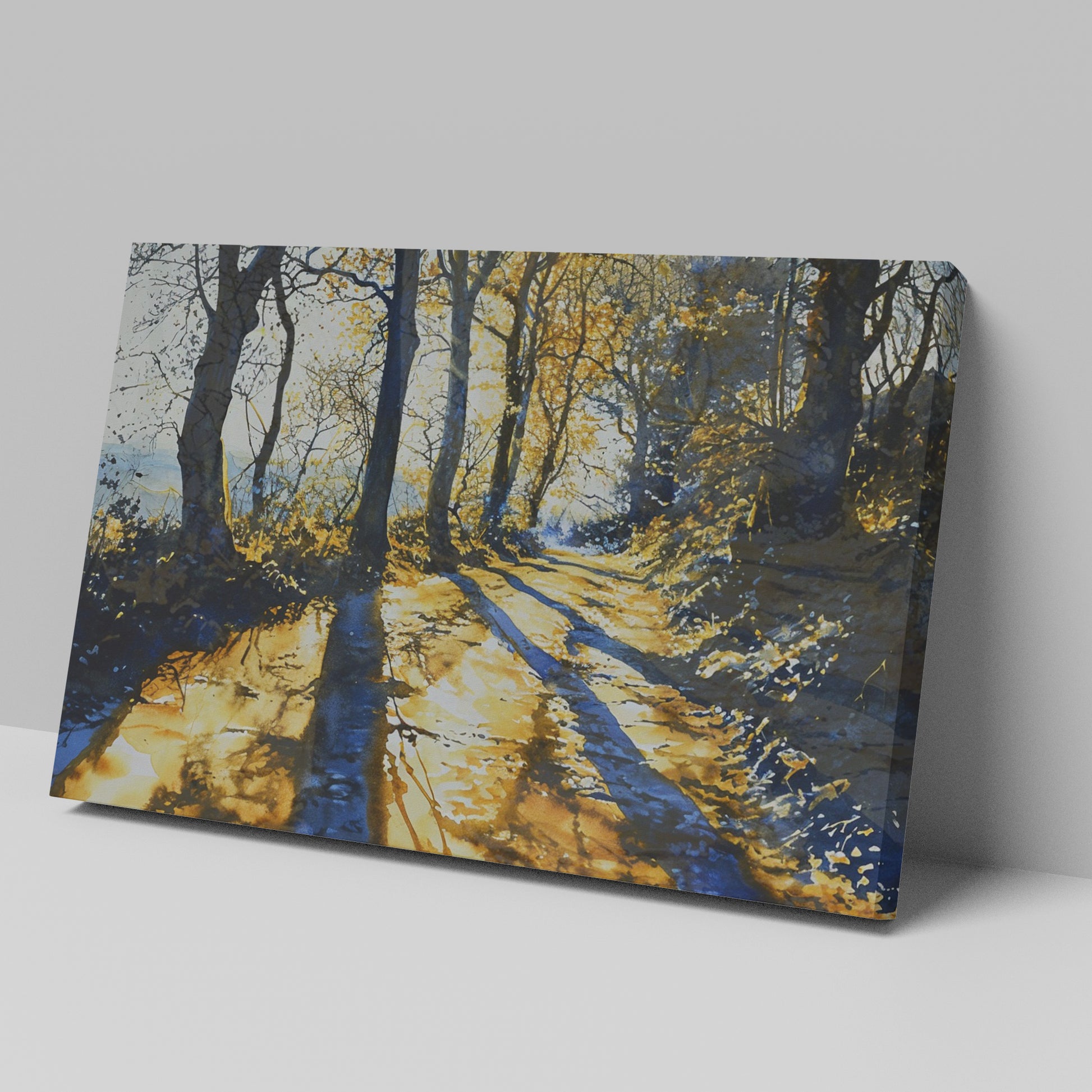 Framed canvas print of a sunlit forest pathway with golden tones and tree silhouettes