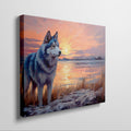 Framed canvas print of a Husky in silhouette against a colourful sunset with reflection on water