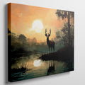 Framed canvas print of a majestic stag against a forest lake at sunrise with orange skies