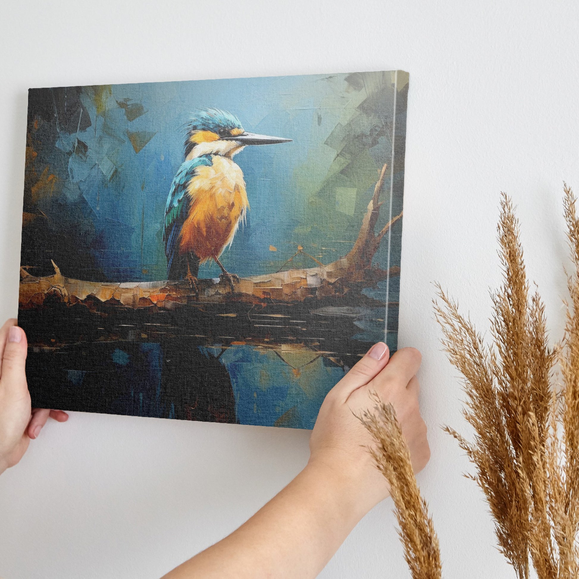 Framed canvas print of a Kingfisher bird with vibrant blue and orange plumage, perched on a branch over reflective water