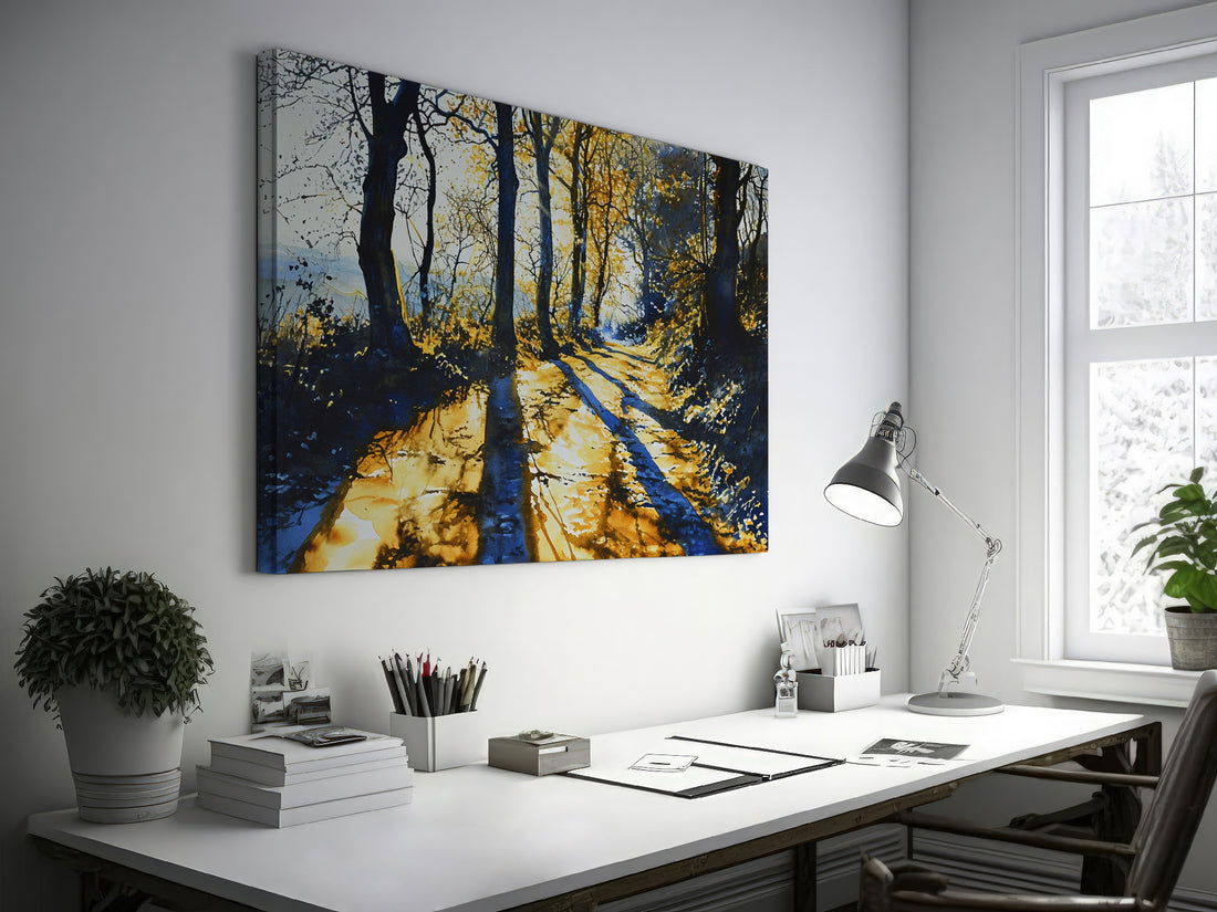 Framed canvas print of a sunlit forest pathway with golden tones and tree silhouettes