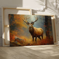 Framed canvas print of a majestic stag standing in an autumn forest with vibrant foliage