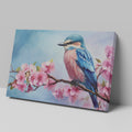 Framed canvas print of a colourful bird on a blossoming cherry branch