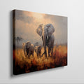 Framed canvas print of a family of elephants in a vibrant, golden savannah sunset