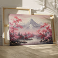 Framed canvas print of serene mountain landscape with pink cherry blossoms and mist