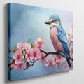 Framed canvas print of a colourful bird on a blossoming cherry branch