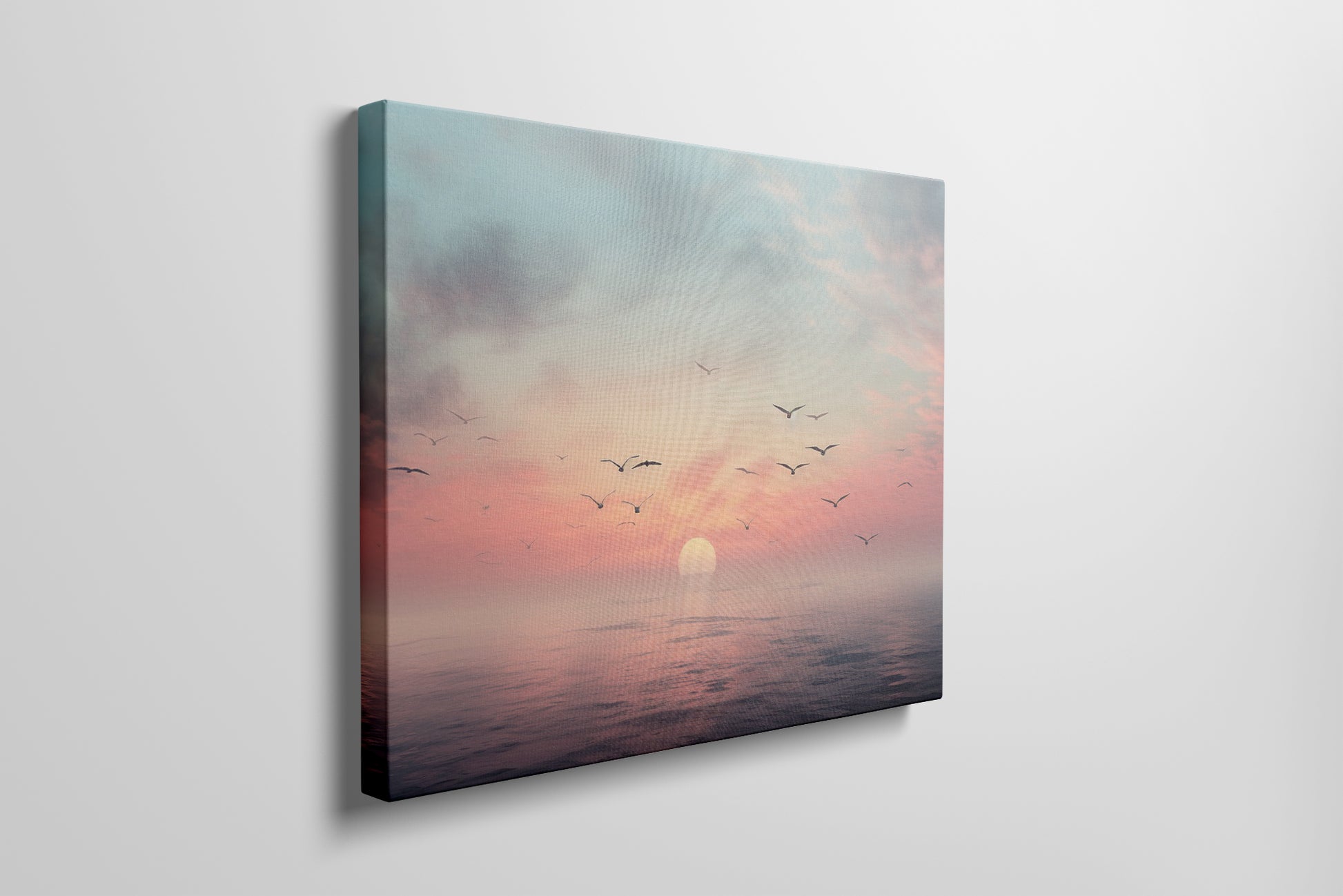 Framed canvas print of a tranquil seascape at sunset with birds and pastel skies