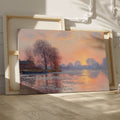 Framed canvas print of an Impressionist-style landscape with a sunset reflecting on a river